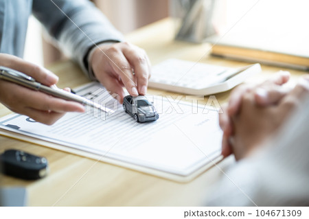Loss Adjuster Insurance Agent Inspecting Damaged Car. .Sales manager giving advice application form document considering mortgage loan offer for car insurance Loss Adjuster Insurance Agent Inspecting Damaged Car. .Sales manager giving advice application form document considering mortgage loan offer for car insurance 104671309