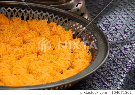 Golden thread egg or Foi Thong on plate. Golden thread egg or Foi Thong on plate. 104671501