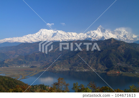 Pokhara, Nepal in South Asia Himalaya Machapuchare, Annapurna Mountain Range and Fewa Lake from Nihonsan Myohoji Temple Pokhara, Nepal in South Asia Himalaya Machapuchare, Annapurna Mountain Range and Fewa Lake from Nihonsan Myohoji Temple 104671613