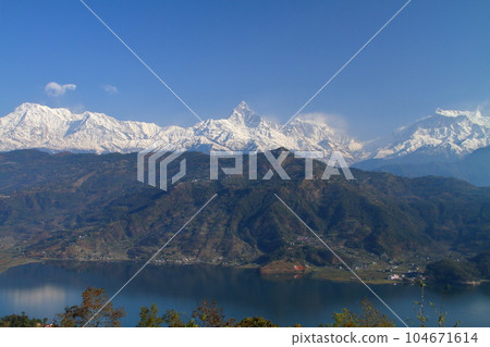Pokhara, Nepal in South Asia Himalaya Machapuchare, Annapurna Mountain Range and Fewa Lake from Nihonsan Myohoji Temple Pokhara, Nepal in South Asia Himalaya Machapuchare, Annapurna Mountain Range and Fewa Lake from Nihonsan Myohoji Temple 104671614