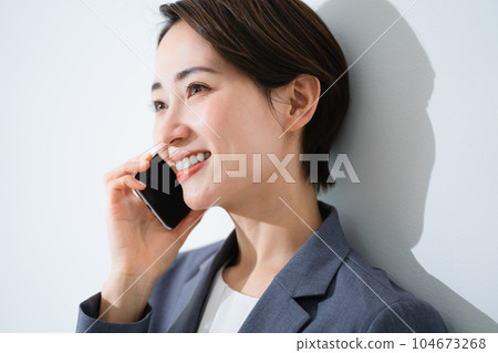 Young woman talking on smartphone business image 104673268