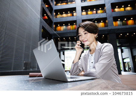 Female business computer smartphone smile call Female business computer smartphone smile call 104673815