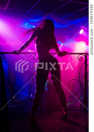 young girl dancer go-go on nightclub scene with sexy figure dancing young girl dancer go-go on nightclub scene with sexy figure dancing 104674388