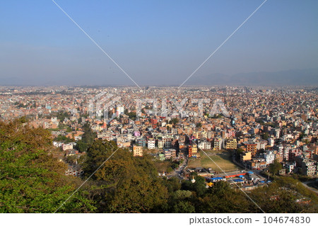 The Kathmandu Valley, a world cultural heritage site in Nepal, overlooking the cityscape from the hilltop Tibetan Buddhist temple Swayambhunath The Kathmandu Valley, a world cultural heritage site in Nepal, overlooking the cityscape from the hilltop Tibetan Buddhist temple Swayambhunath 104674830