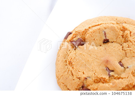 A chocolate chip cookie with a bittersweet flavor 104675138