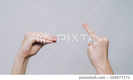 Blah gesture. Middle finger. Woman hands arguing showing fuck off quarrel demonstrating aggressive sign isolated on gray free space background. Blah gesture. Middle finger. Woman hands arguing showing fuck off quarrel demonstrating aggressive sign isolated on gray free space background. 104677171