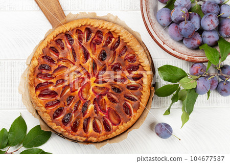 Homemade plum pie. Fruit tart with seasonal fruits Homemade plum pie. Fruit tart with seasonal fruits 104677587