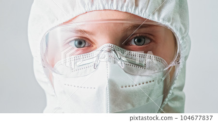 Laboratory specialist. Covid-19 protection. Coronavirus epidemic. Woman healthcare doctor in medical protective equipment isolated on grey background. 104677837