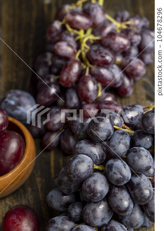 Ripe fresh grapes on a board 104678296