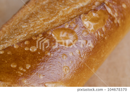 French long bread made of wheat flour, fresh baguette French long bread made of wheat flour, fresh baguette 104678370