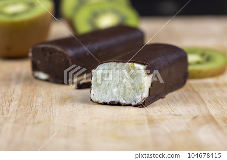 sweet green cottage cheese with kiwi flavor in chocolate glaze sweet green cottage cheese with kiwi flavor in chocolate glaze 104678415