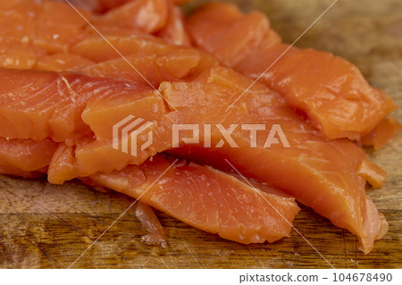 sliced pieces of trout fillet, close up sliced pieces of trout fillet, close up 104678490