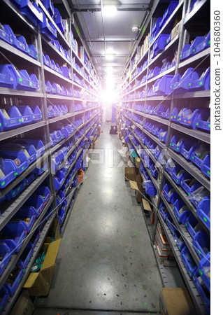 Industrial warehouse. Warehouse of a trade organization. Goods and materials arranged on a rack in warehouse. Warehouse store stock Industrial warehouse. Warehouse of a trade organization. Goods and materials arranged on a rack in warehouse. Warehouse store stock 104680360
