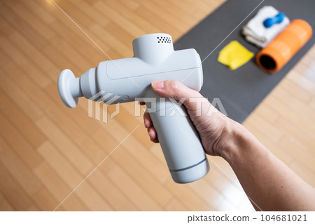 hand held massage gun 104681021