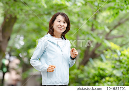 Senior woman fresh green walking running 104683701