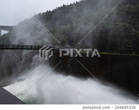 Okuchichibu Water discharge from Takizawa Dam and suspension bridge Okuchichibu Water discharge from Takizawa Dam and suspension bridge 104685326