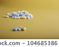 Pills On Orange Surface 104685386