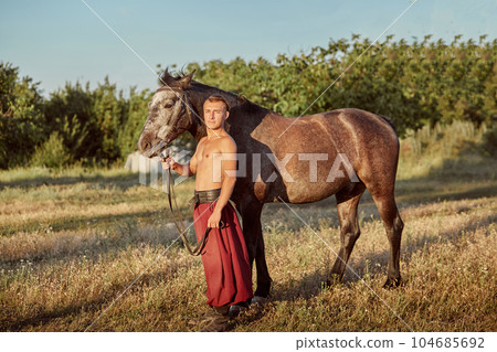 Cossack and his horse. Ukraine. Zaporozhye Sech. 104685692