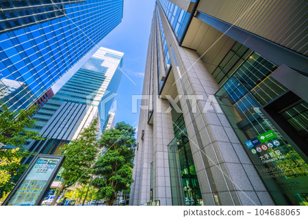 Tokyo cityscape in Japan July - Otemachi Station (entrance) and office buildings. Right: Otemachi Park Building = 6th 104688065