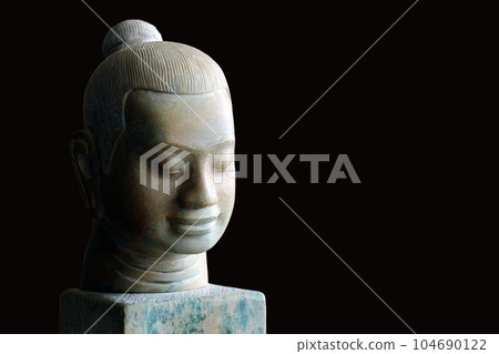 Stone faces of Jayavarman VII, isolated on black background. Stone faces of Jayavarman VII, isolated on black background. 104690122