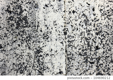 Old dark gray grungy concrete wall, background photo texture.  104690212