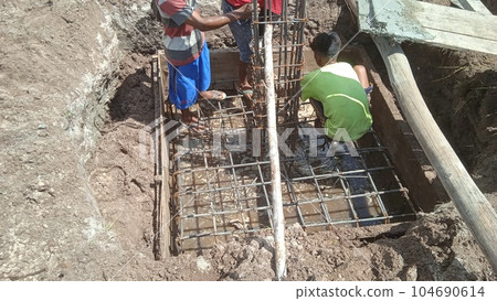 Foundation site of new building, details and reinforcements with steel bars and wire rod 104690614