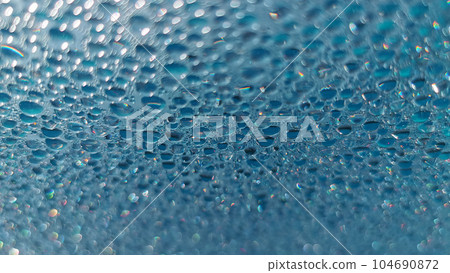 Water drops. Condensed water in the form of hanging drops on the outdoor pool cover. Water drops. Condensed water in the form of hanging drops on the outdoor pool cover. 104690872