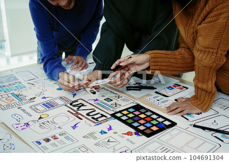 Team of Creative Web, Graphic Designer planning for mobile phone, drawing website ux ui app for mobile phone application and development template layout, process to developing prototype wireframe Team of Creative Web, Graphic Designer planning for mobile phone, drawing website ux ui app for mobile phone application and development template layout, process to developing prototype wireframe 104691304