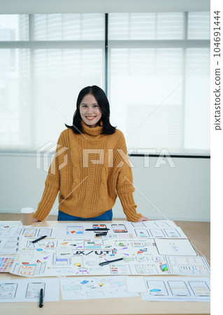 Group of asian creative team programing designers participate in all phases of the UX UI design 104691444