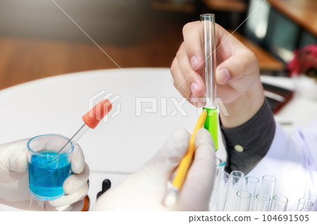 Team of researcher or scientists working in laboratory. 104691505