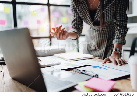 Beautiful young teen asian business woman meeting at on computer laptop with planning working on financial document, tax, exchange, accounting and Financial advisor. Beautiful young teen asian business woman meeting at on computer laptop with planning working on financial document, tax, exchange, accounting and Financial advisor. 104691639