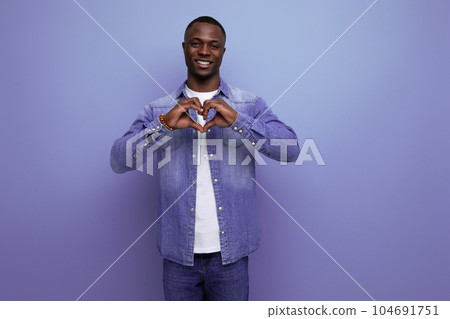 young handsome african guy in spring urban clothes isolated with copy space background young handsome african guy in spring urban clothes isolated with copy space background 104691751