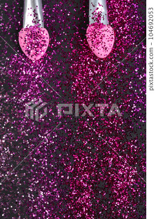 Colorful glitter crystals of eyelids makeup on black background. Beauty and fashion concept. Colorful glitter crystals of eyelids makeup on black background. Beauty and fashion concept. 104692053