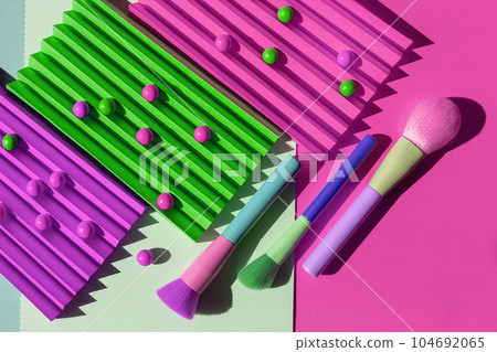Set of fashion makeup brushes collection with shadow on different colors background. Creative cosmetic or beauty concept. Set of fashion makeup brushes collection with shadow on different colors background. Creative cosmetic or beauty concept. 104692065