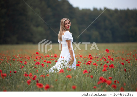 Girl in a flower field Girl in a flower field 104692382