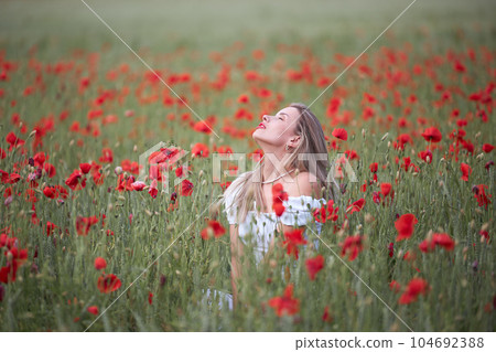 Girl in a flower field Girl in a flower field 104692388