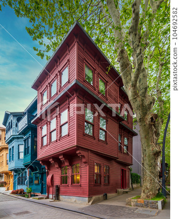 Facade of colorful wooden houses painted in red and blue, located in Kuzguncuk, Uskudar district, Istanbul, Turkey Facade of colorful wooden houses painted in red and blue, located in Kuzguncuk, Uskudar district, Istanbul, Turkey 104692582