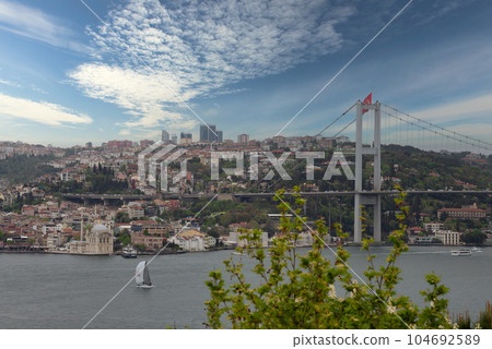 Morning shot of Istanbul city from Fethi Pasha Grove overlooking Bosphorus Bridge, or Bogazici Koprusu, Istanbul, Turkey Morning shot of Istanbul city from Fethi Pasha Grove overlooking Bosphorus Bridge, or Bogazici Koprusu, Istanbul, Turkey 104692589