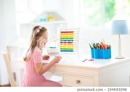 Child drawing. Kids paint. Girl after school. 104693096