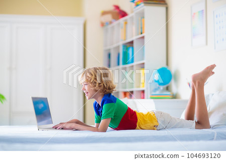 Online remote learning. School kids with computer. Online remote learning. School kids with computer. 104693120