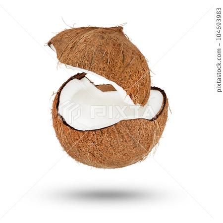 Flying coconut. Half of a coconut with a flying lid on a white isolated background. Part of the coconut hangs or falls, casting a shadow. Flying coconut. Half of a coconut with a flying lid on a white isolated background. Part of the coconut hangs or falls, casting a shadow. 104693983