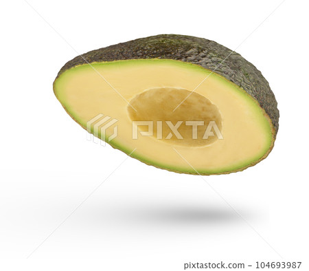 Falling fruits. Half of an avocado on a white isolated background. Avocado with pitted crust inside casting a shadow. Seedless avocado isolate. To insert into a project. Side view. Falling fruits. Half of an avocado on a white isolated background. Avocado with pitted crust inside casting a shadow. Seedless avocado isolate. To insert into a project. Side view. 104693987