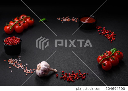 Ingredients for cooking cherry tomatoes, salt, spices and herbs 104694300