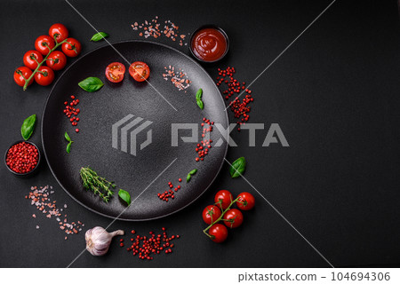 Ingredients for cooking cherry tomatoes, salt, spices and herbs Ingredients for cooking cherry tomatoes, salt, spices and herbs 104694306