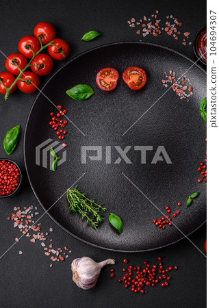 Ingredients for cooking cherry tomatoes, salt, spices and herbs Ingredients for cooking cherry tomatoes, salt, spices and herbs 104694307