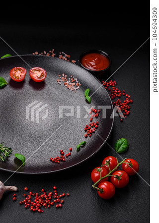Ingredients for cooking cherry tomatoes, salt, spices and herbs 104694309