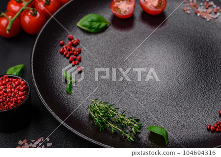 Ingredients for cooking cherry tomatoes, salt, spices and herbs 104694316