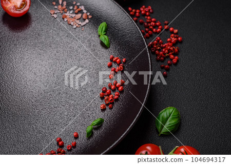 Ingredients for cooking cherry tomatoes, salt, spices and herbs Ingredients for cooking cherry tomatoes, salt, spices and herbs 104694317