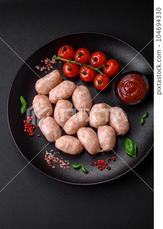 Fresh raw sausages from pork or chicken with salt, spices and herbs 104694330
