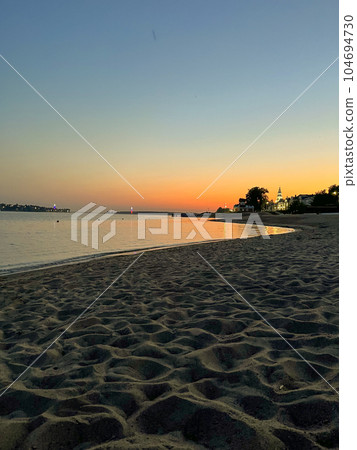 sunset over the river on a summer evening sunset over the river on a summer evening 104694730